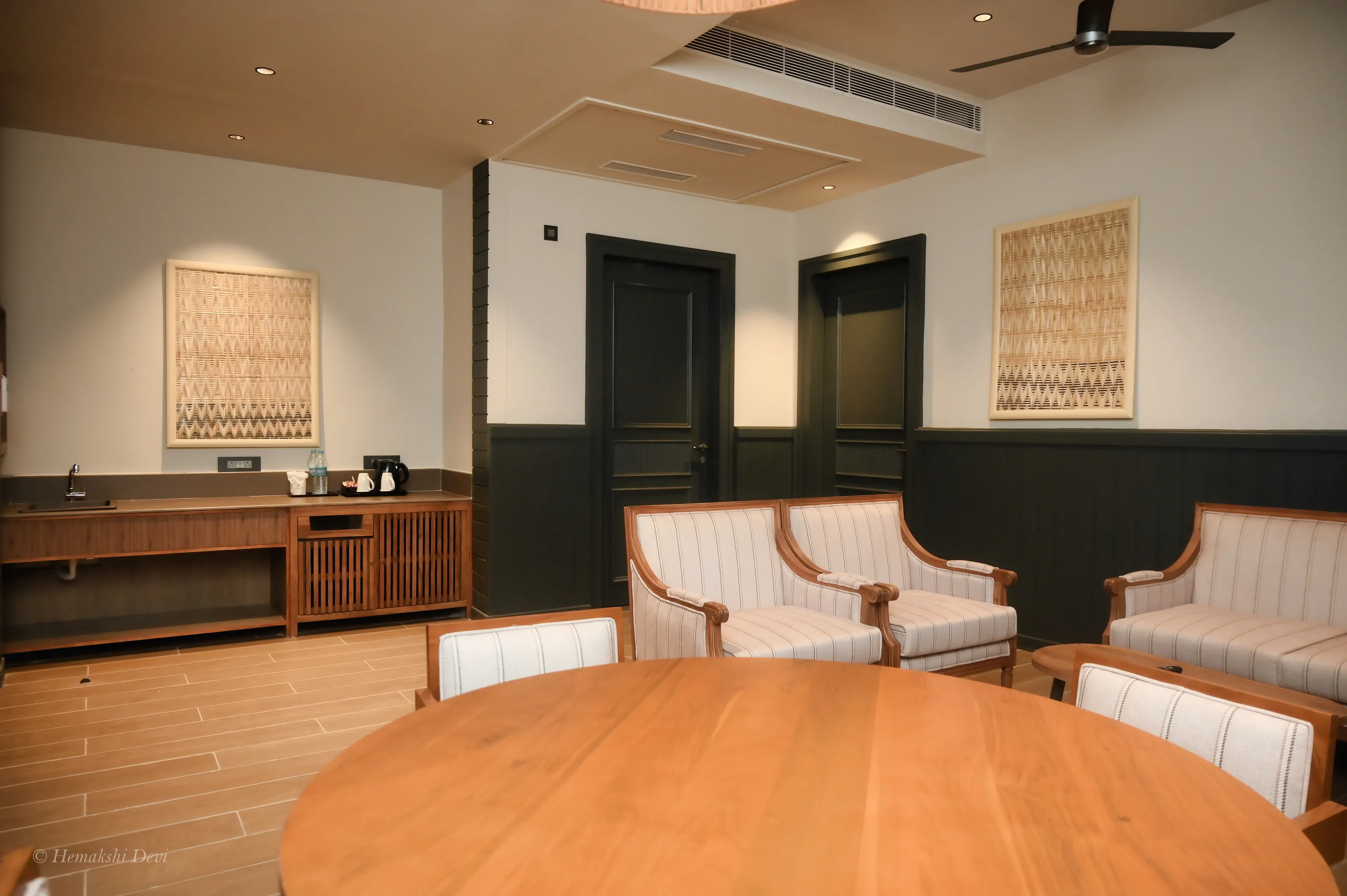 Bamboo-weave art panel in a light wood floating frame, in a guest room
